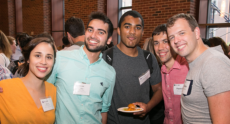 Students smiling at OutLaw/LACA reception