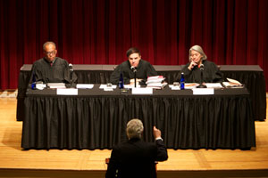 Judges listening to attorney