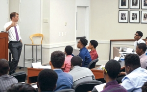 Trevor Morrison teaching high school students