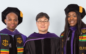 Hyundai Motor Scholar in Law and Business Raymond Diggs and Kia Motors Scholar in Law and Business Ijeamaka Gwendolyn Obasi were hooded by Jongyun Kim, director of corporate planning representing Karl Kim, executive vice president, Hyundai Motor Group