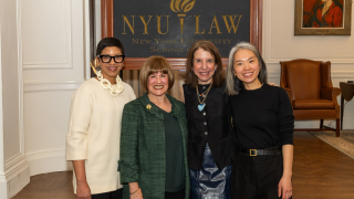 Melissa Murray, Marcy Syms, Jennifer Weiss-Wolf, and Ting Ting Cheng in front of NYU Seal
