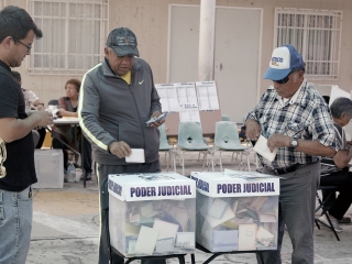People casting ballots in judicial elections.