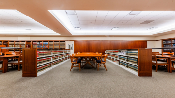 Study tables surrounded by low bookshelves