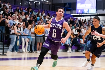 NYU Law student dribbling basketball