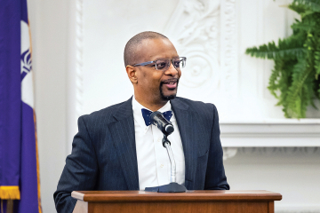 Dean Troy McKenzie at a podium