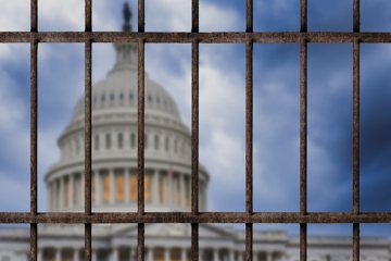 View of the Capitol building from behind bars