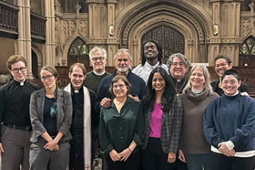 Group of people standing together, featuring Ravi Ragbir, Alina Das ’05, Jessica Rofe '14, Djibril Branche '26, and Mariel Gonzalez-Medellin '26 