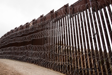 Layers of Concertina are added to existing barrier infrastructure along the U.S. - Mexico border near Nogales, AZ, February 4, 2019. Photo: Robert Bushell