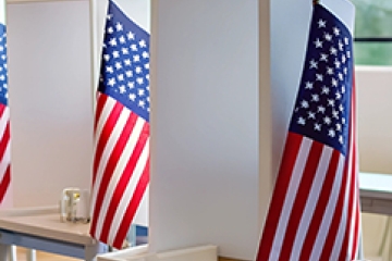 Voting booths with American flags