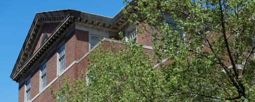 Outside of corner of Vanderbilt Hall with trees