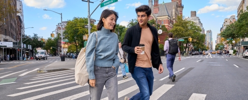 Two students crossing intersection in Greenwich Village