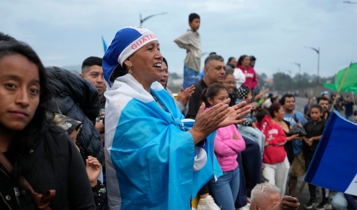 Protesters block an access road in Guatemala City.