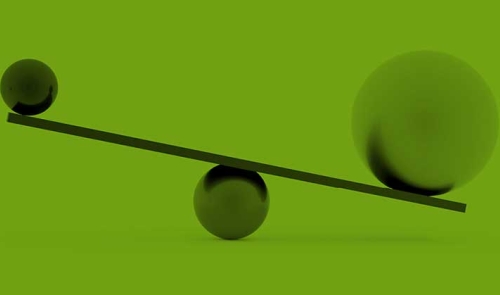 Seesaw balancing larger ball and smaller ball