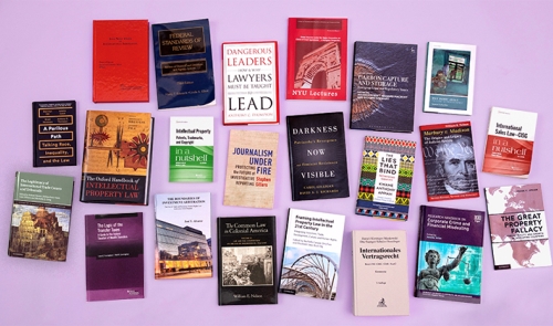 photo of 22 books by NYU Law faculty members