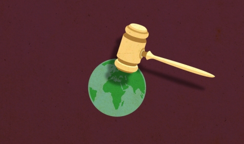gavel on top of world map
