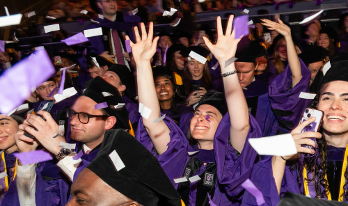 Cheering graduates at NYU Law Convocation 2026