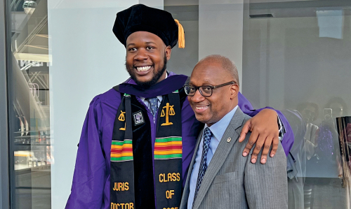 Coleman Powell ’25 with his father, Cedric Powell ’87