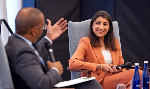 Dean Troy McKenzie ’00 gestures during a public conversation with former FTC Commissioner Lina Khan in the 2025 Katzmann Lecture.