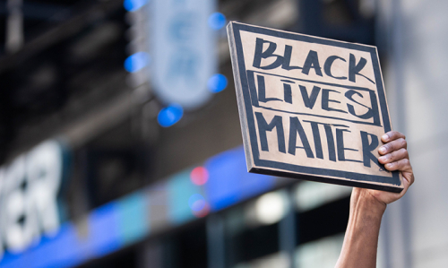 Protest sign reading "Black Lives Matter"