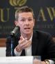 Chris Hughes speaking on a panel at the Latham & Watkins Forum bout Reigning in Big Tech