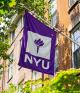 Nyu Flag hanging from a building, waving in the wind