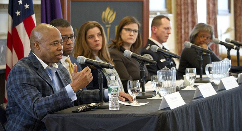 People speaking at a conference