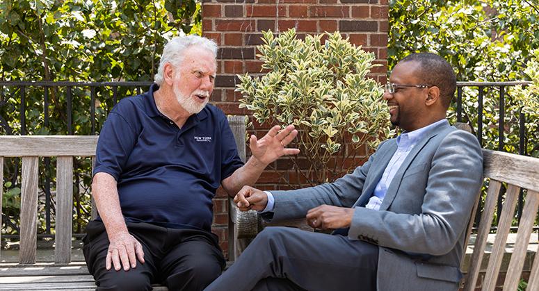 John Sexton and Troy McKenzie chatting in the Vanderbilt Hall Courtyard 