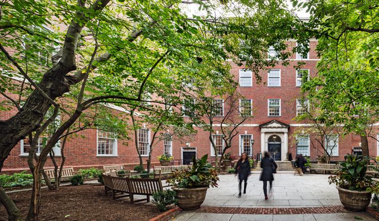 Photo of students walking through NYU Law courtyard