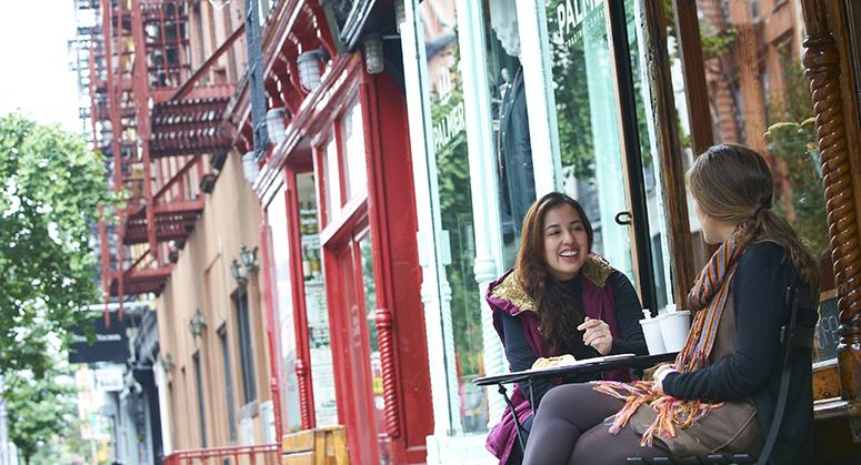 Students sitting at cafe in Greenwich Village