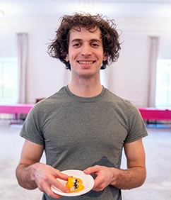 Student holding bake off entry
