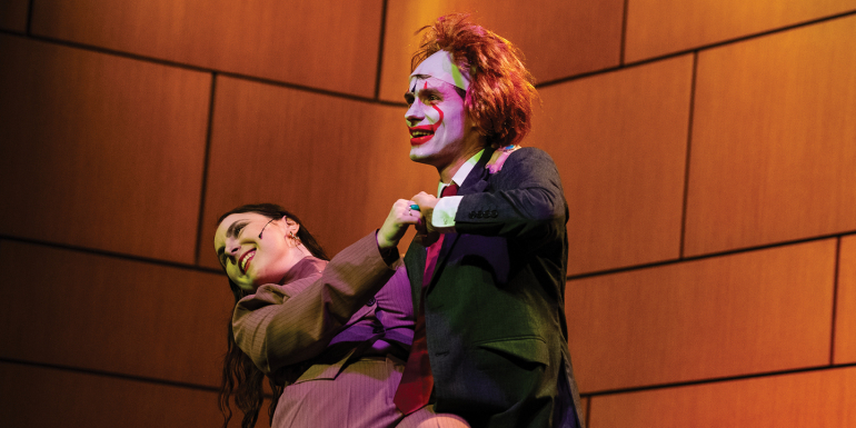 Two students perform onstage in 2026 law revue