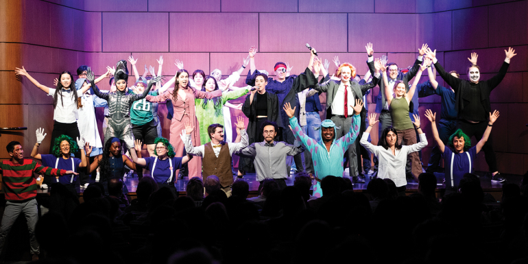 Cast of 2026 law revue poses onstage
