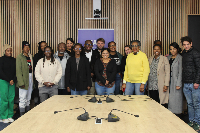 A group of scholars at an event titled Lost in Transition: Race, Reparations & Environmental Justice
