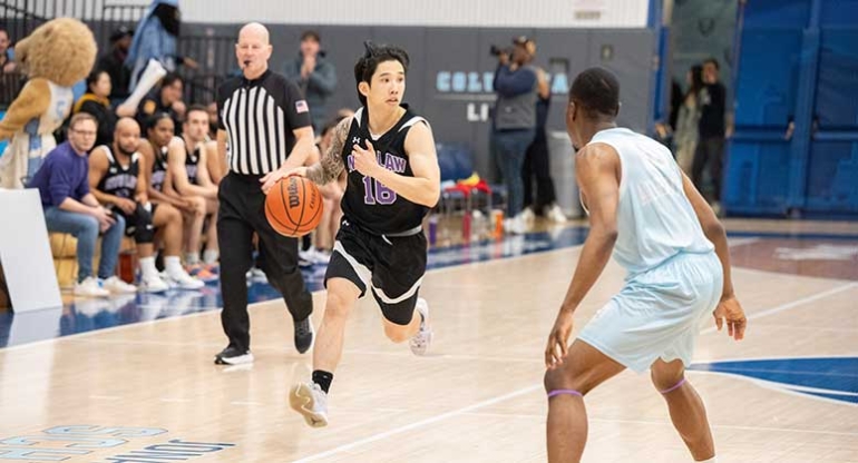 NYU Law player with ball in Deans' Cupl
