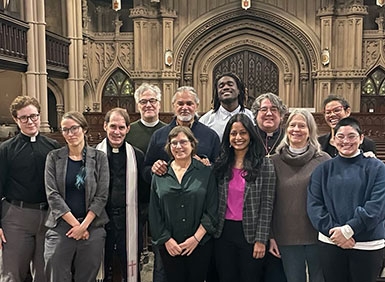 Group of people standing together, featuring Ravi Ragbir, Alina Das ’05, Jessica Rofe '14, Djibril Branche '26, and Mariel Gonzalez-Medellin '26 