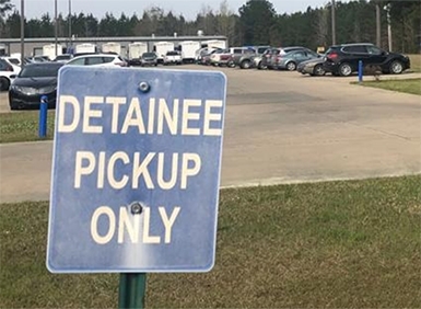 detainee pick up sign in parking lot of detention facility