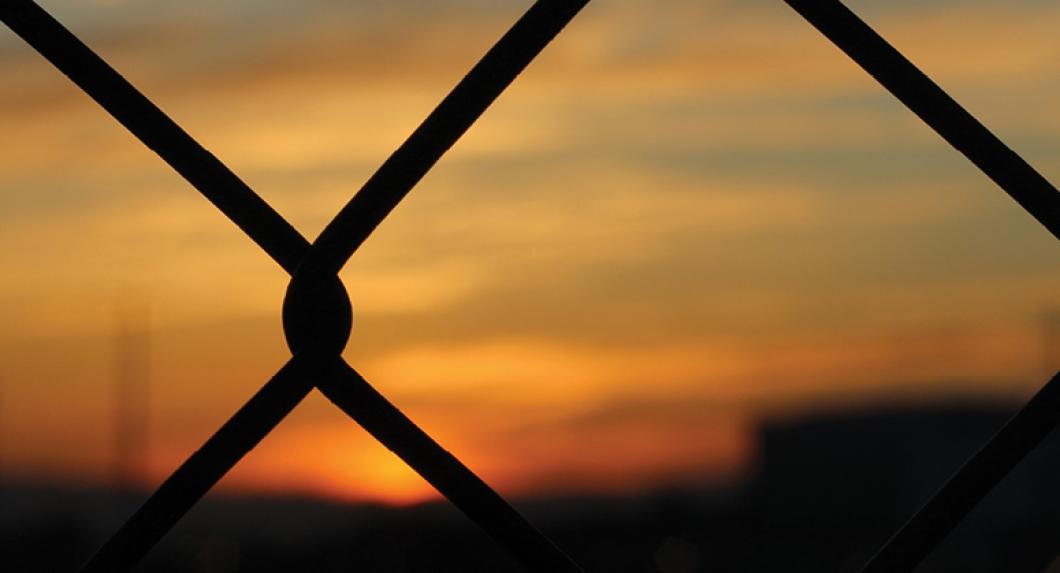 chainlink fence at sunset