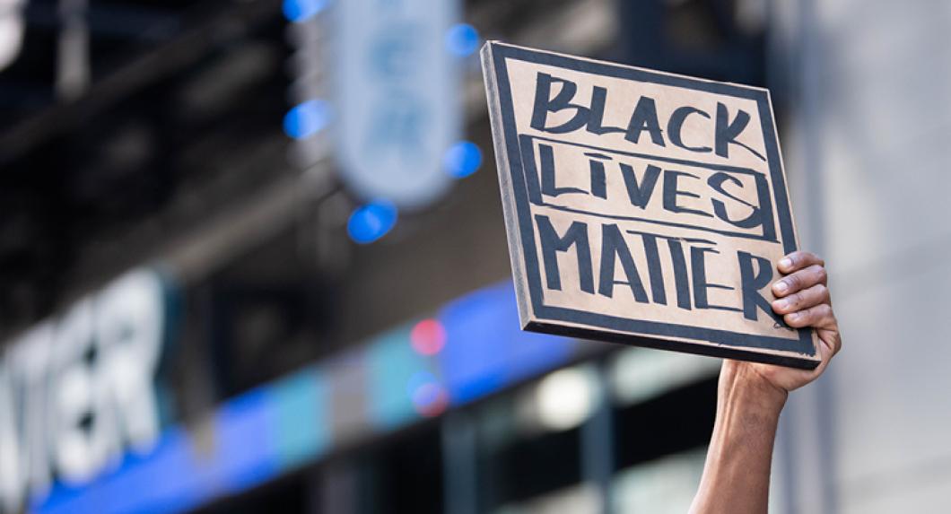 Protest sign reading "Black Lives Matter"