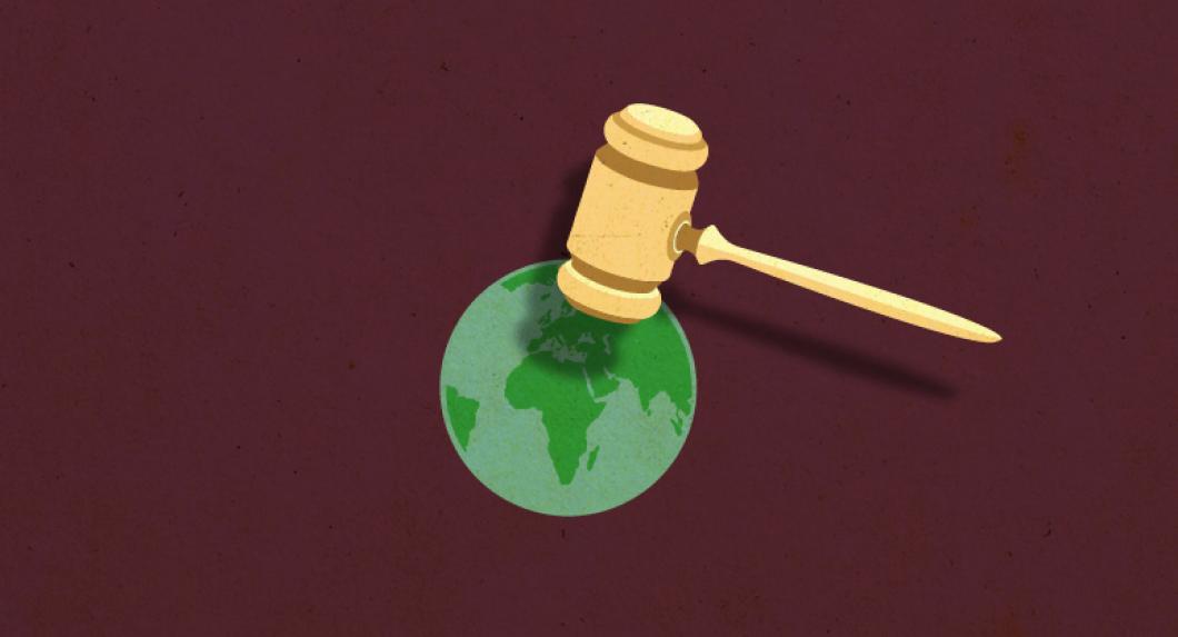 gavel on top of world map