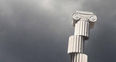 Fragmented greek column with storm clouds in background