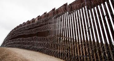 Layers of Concertina are added to existing barrier infrastructure along the U.S. - Mexico border near Nogales, AZ, February 4, 2019. Photo: Robert Bushell