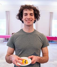 Student holding bake off entry