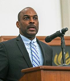 Kenneth W Mack speaking at podium