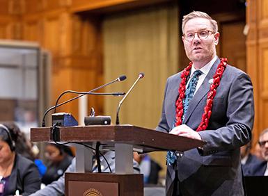 Bryce Rudyk standing at lectern in International Court of Justice
