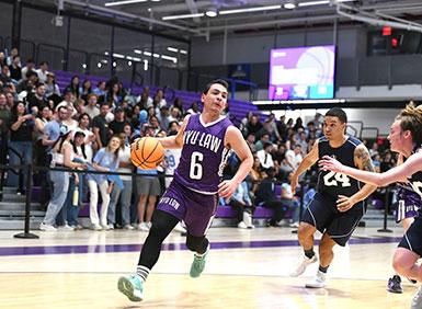 NYU Law Student Dribbing Ball Down Basketball Court