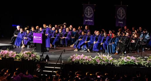 Faculty and speakers assembled on stage at 2025 Convocation