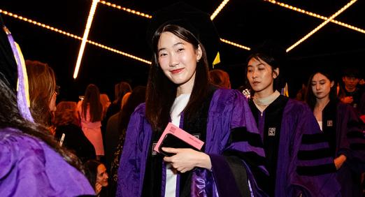 Graduate walking down aisle at 2025 Convocation