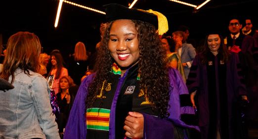 Graduate walking down aisle at 2025 Convocation