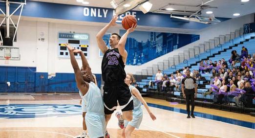 NYU Law player with ball in Deans' Cup