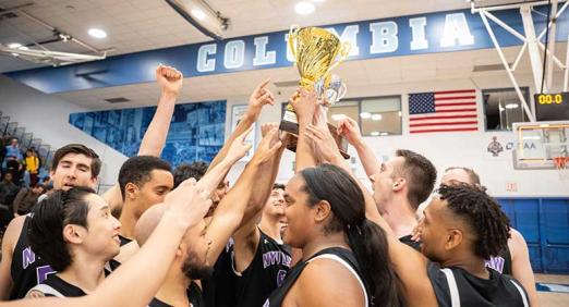 NYU Law players hoisting trophy